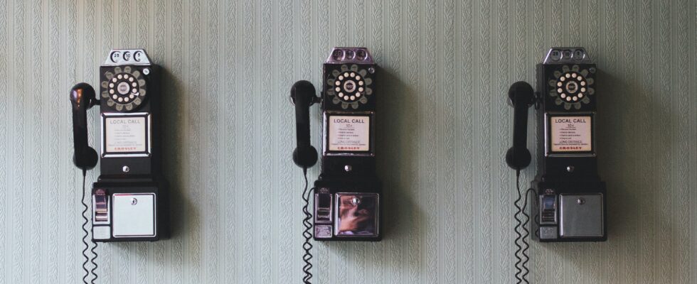 minimalist photography of three crank phones