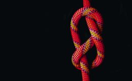 white and red rope on black background