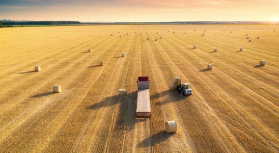 Aerial view of truck with hay bales. Agricultural machinery