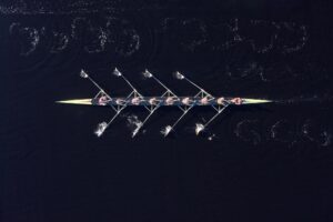 Elevated view of female's rowing eight in water