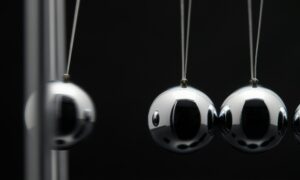 Closeup Of Newton Balls With Swinging Metal Spheres