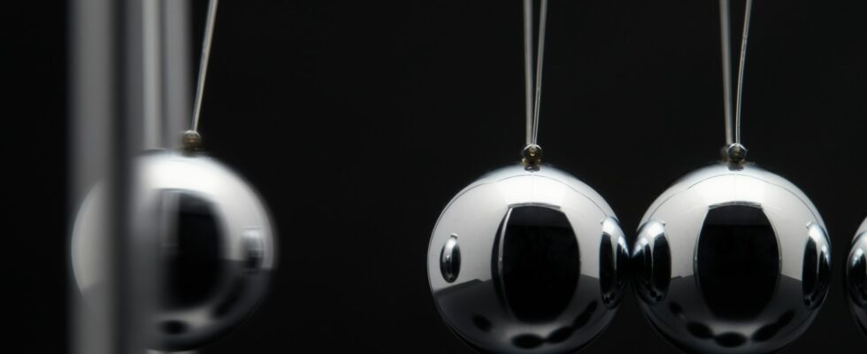 Closeup Of Newton Balls With Swinging Metal Spheres