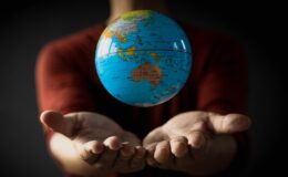 Globe floating above the hand