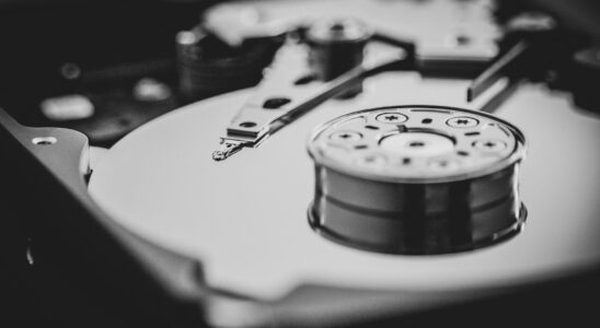white and black turntable in grayscale photography