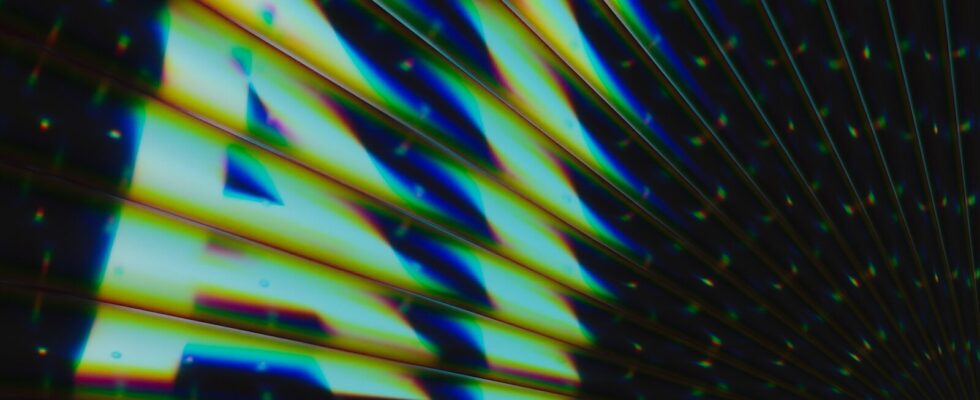 "a.n. is gleaming in colorful, diagonal lines."