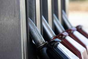 a row of knives hanging on the side of a building