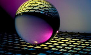 blue and black ball on blue and white checkered textile