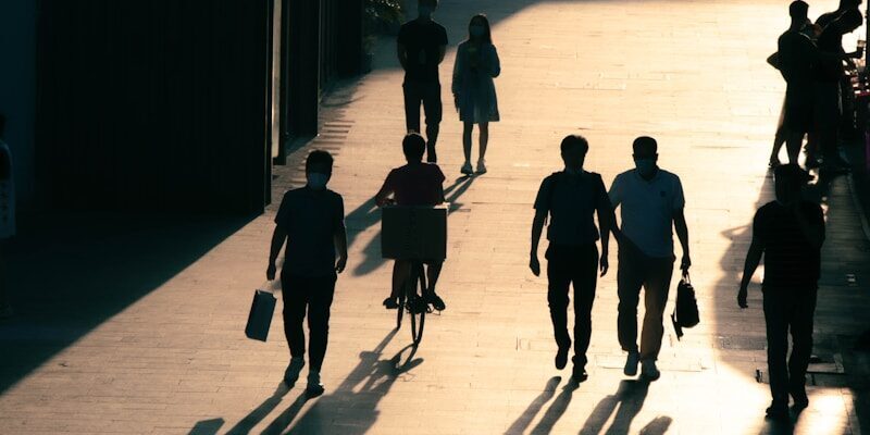 people walking on sidewalk during daytime